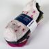 Clothing: Assorted socks and ornament